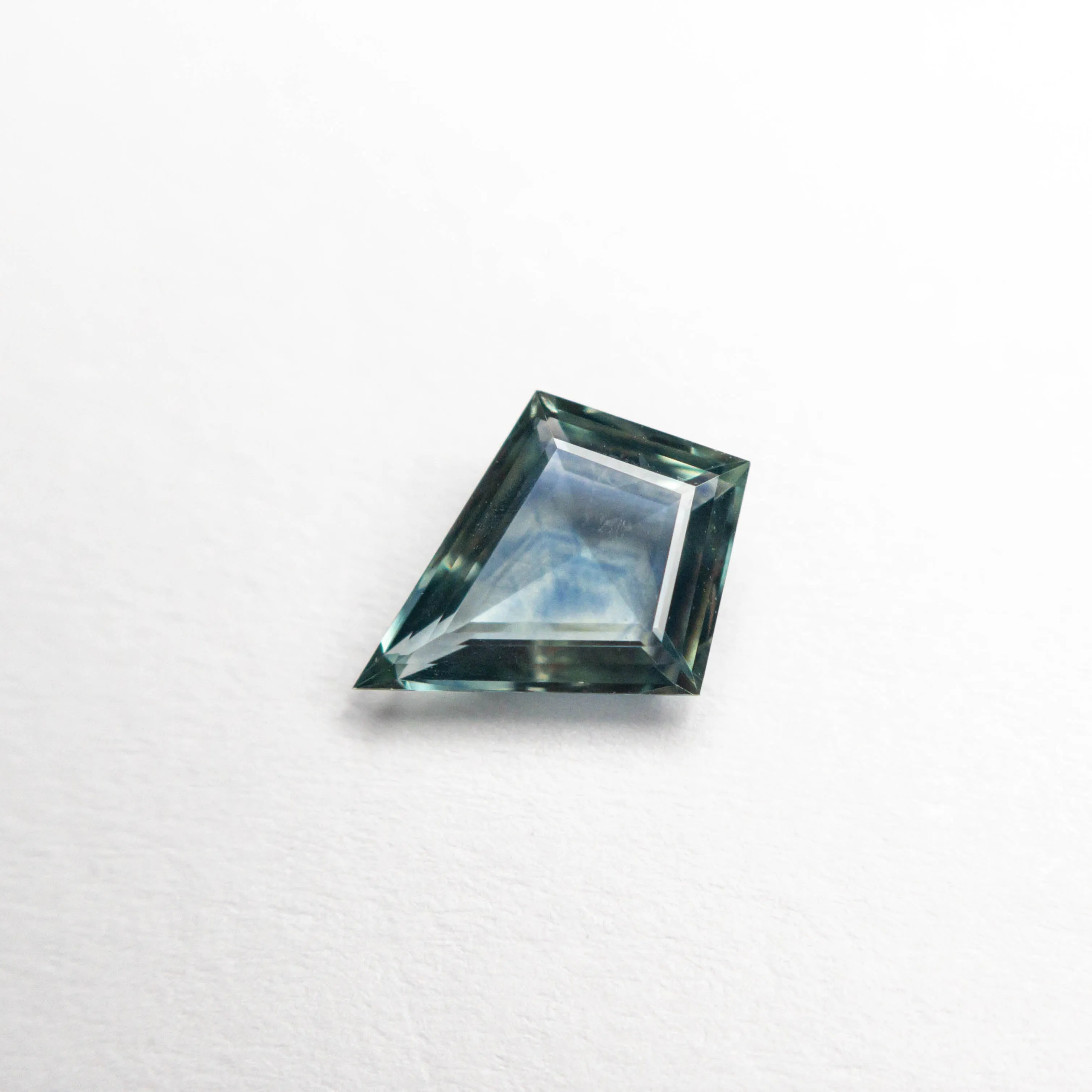 0.60ct 7.77x5.91x2.16mm Kite Step Cut Sapphire 22266-10